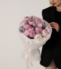 Light pink peonies with delphinium